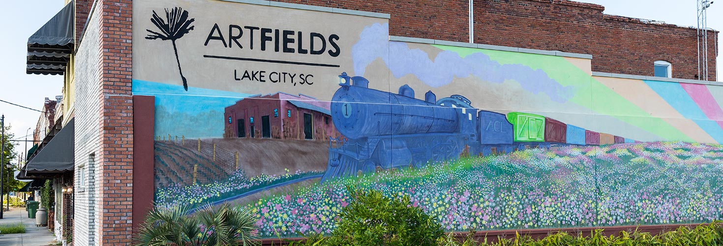 Mural of train on side of building
